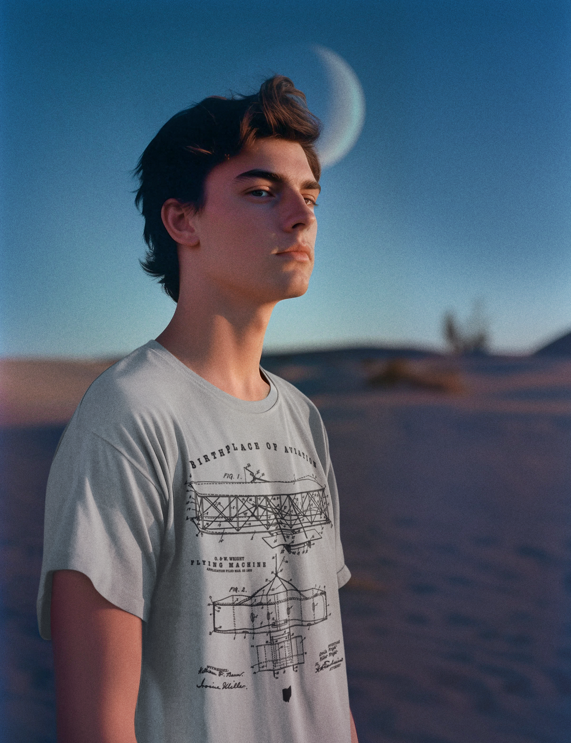 dune-inspired-mockup-featuring-a-man-wearing-a-round-neck-t-shirt-m34999.png